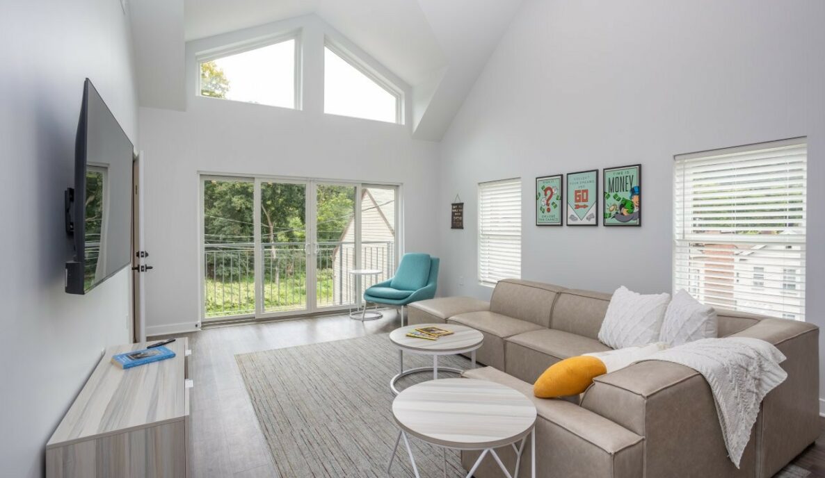 Living room with couch and large windows