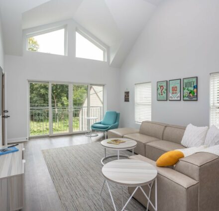 Living room with couch and large windows